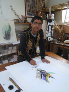 Salih calligraphe dans son atelier à Orléans